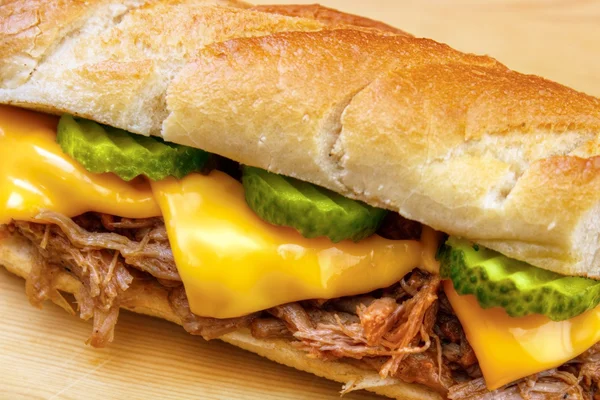 Pulled pork baguette sandwich with cheese