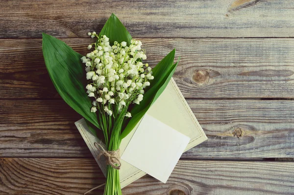 Romantic bouquet with spring lilies of the valley