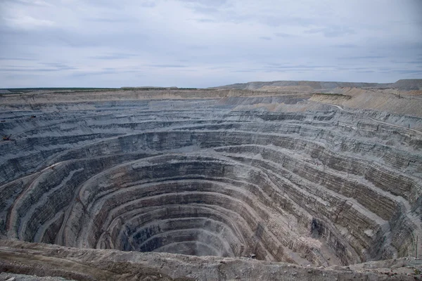 Aerial view to the diamond open mine in Udachny town