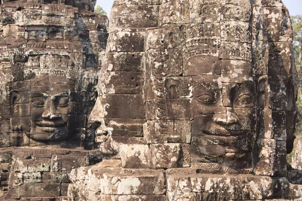 Four sides stone faces of Bayon temple in Angkor - Khmer ancient