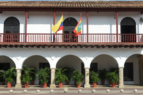 White building in Colonial style with Colombian flag in Cartagena