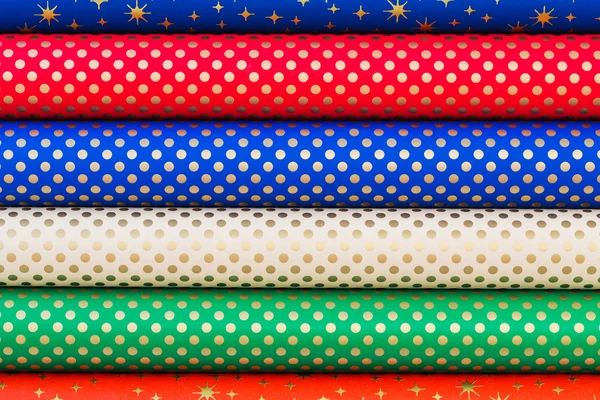 Colorful rolled paper for wrapping gifts. Colorful background