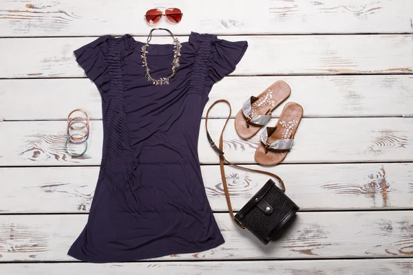 Purple dress with accessories.