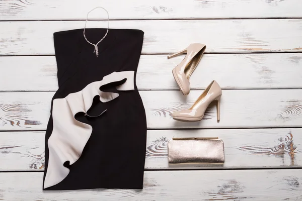 Black dress and beige heels.