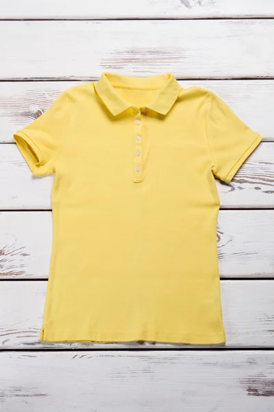 Yellow polo shirt.