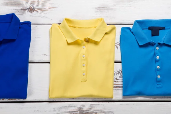 Navy, blue and yellow t-shirts.