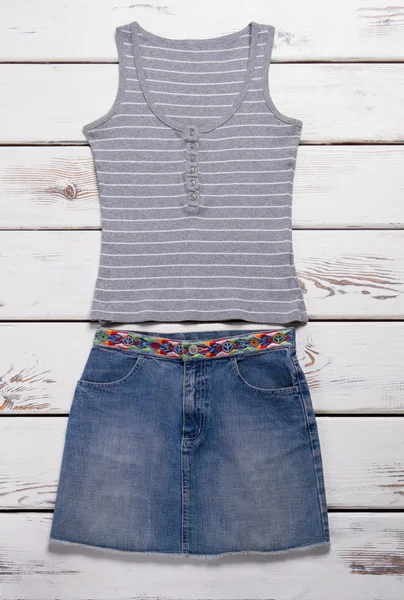 Jeans skirt and tank top.