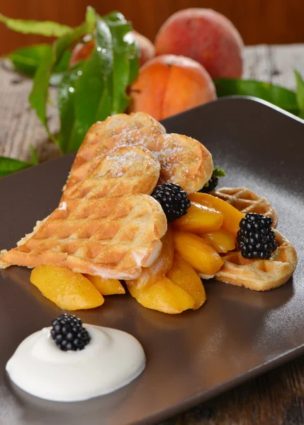 Belgian waffles with fresh peaches
