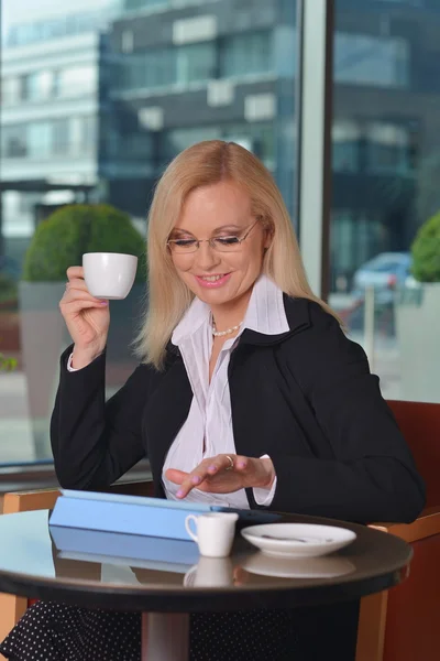 Attractive middle-aged blond businesswoman