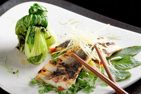Grilled sea bass fillet with ginger, fresh peppers