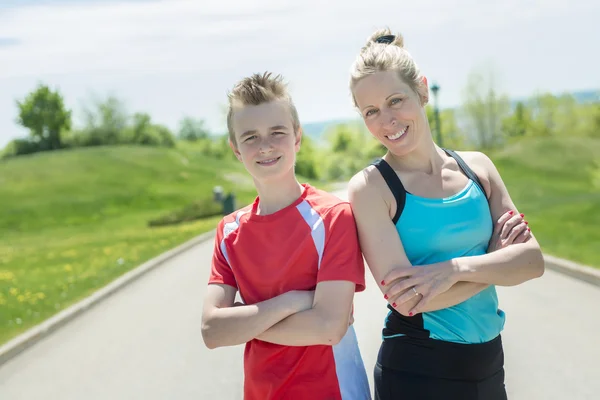 Family, mother and son are running or jogging for sport outdoors
