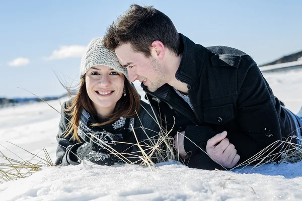 Couple In winter Snow Scene at beautiful sunny day