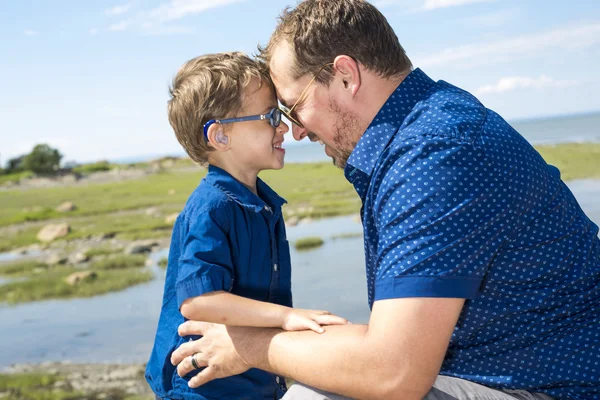 Father And Son Hugging On Outdoor summer