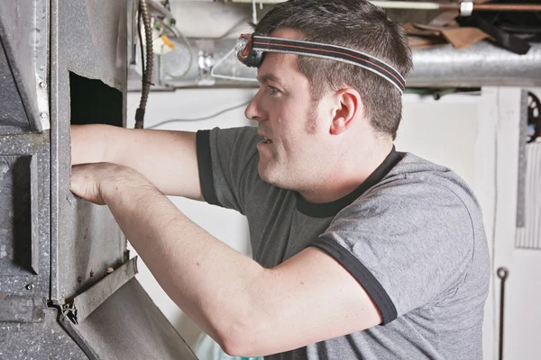 Ventilation cleaner man at work with tool