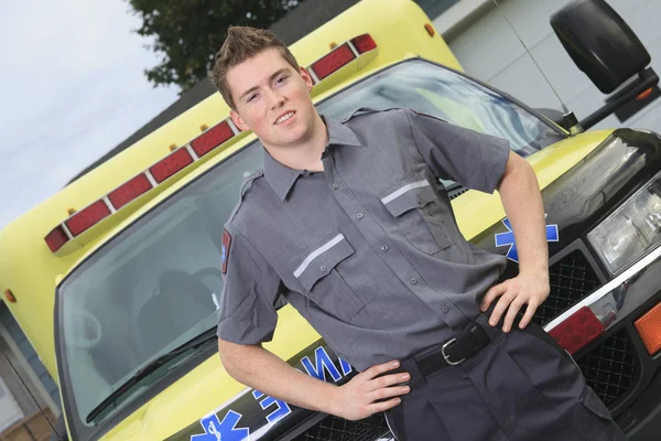 Paramedic employee with ambulance
