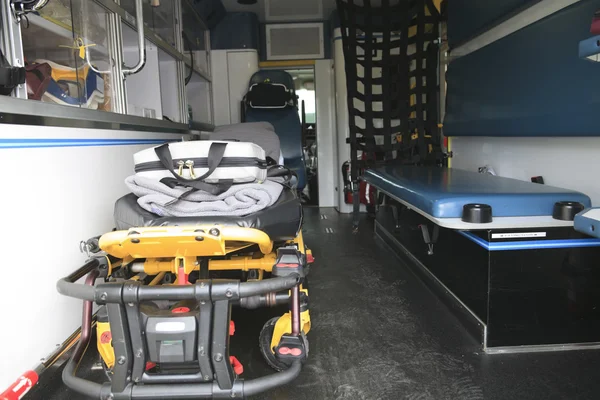 The Inside of a paramedic ambulance with stretcher on it.