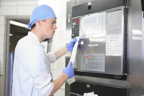 Medical staff sterilizing hands and arms before surgery