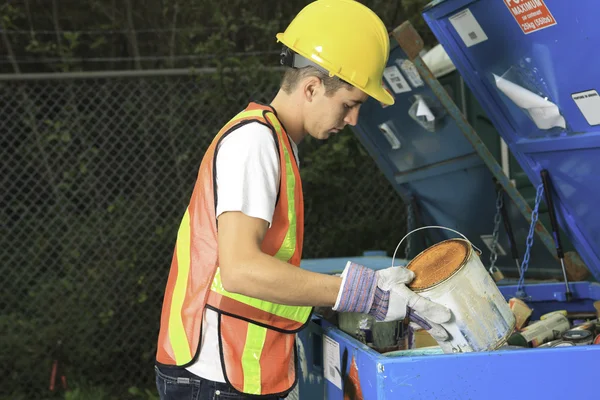 A worker who recycling thing on recycle center