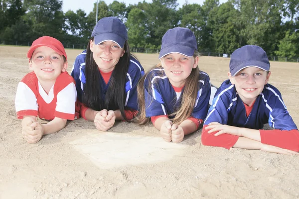 A Baseball team lay on the ground