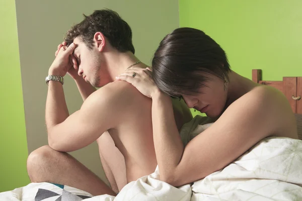 Young couple who having problem in bed