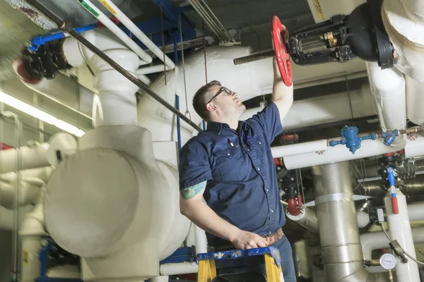 A good serviceman working on a machine room