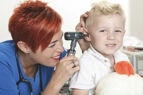 A Doctor Examining cute little boy