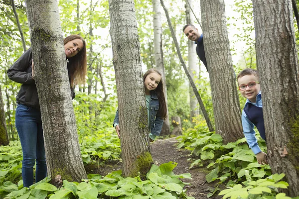 Family in forest having fun together