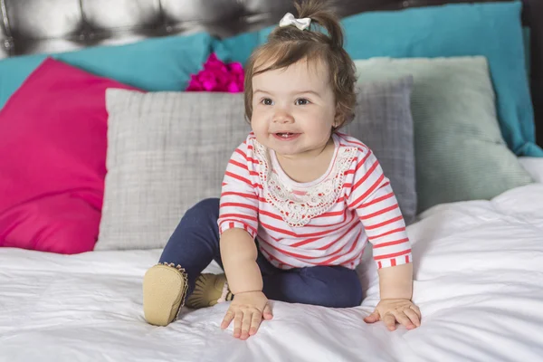 One year old girl in bed