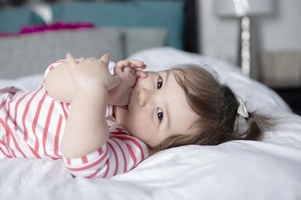 One year old girl in bed