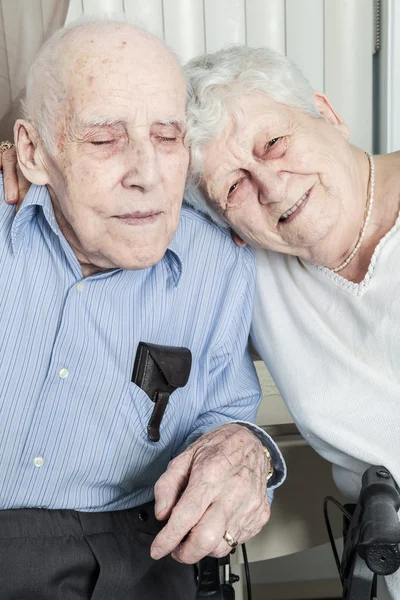 Close-up portrait of an elder couple at home