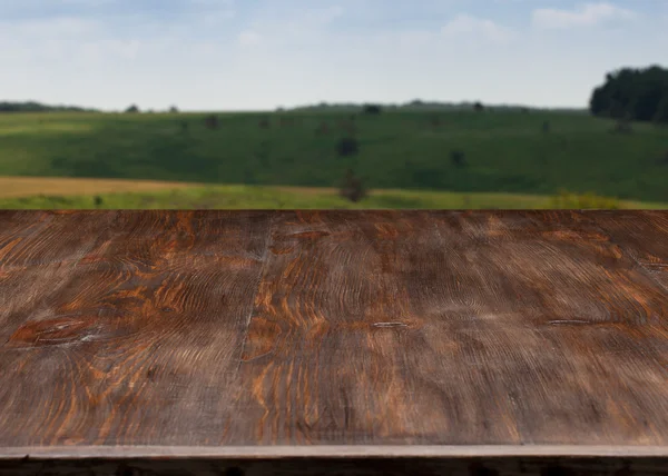 Very nice wooden table with the landscape.