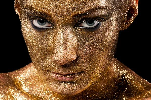 Face in gold. .