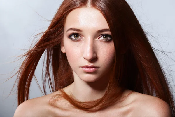 Portrait of red-haired girl.