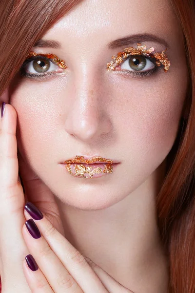 Portrait of red-haired girl.