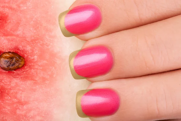 Pink nails and watermelon.