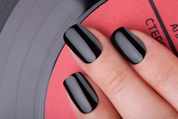 Very beautiful black nails close up.