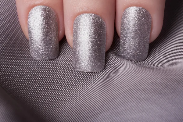 Silver nail polish.