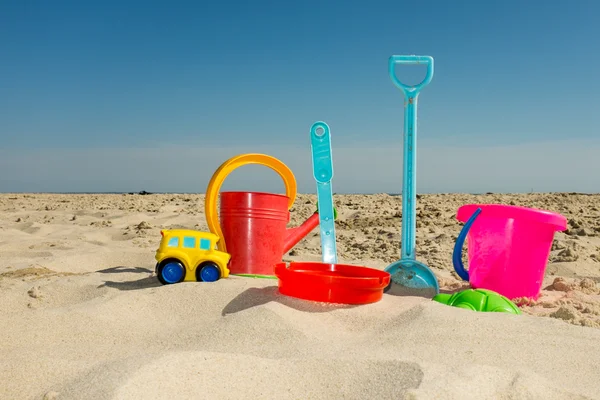 Children\'s beach toys and sand isolated on white