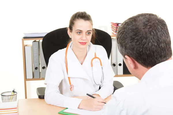 Doctor female listening to a patient at her practice