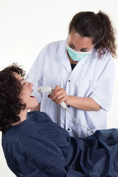 Woman during the process of teeth whitening