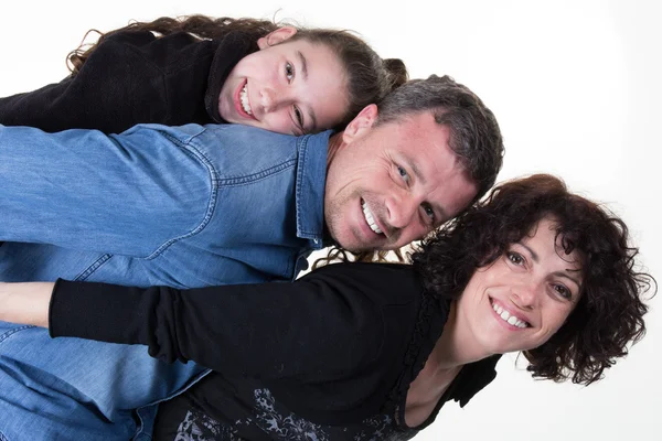 Happy family with one girl, smiling at the camera isolated
