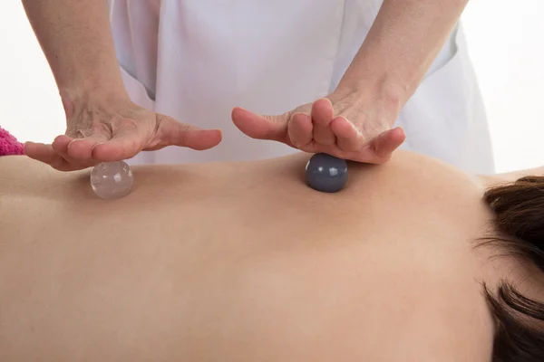 Spa massage with two stones ball at beauty center