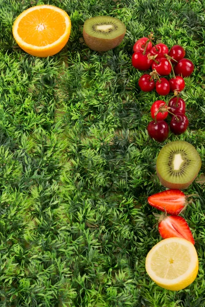 Mix fruits background.Healthy eating, dieting concept, clean eating on green
