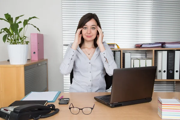 Picturet of an exhausted office worker at desk