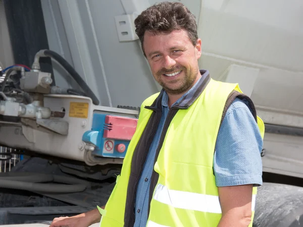 Happy truck driver smiling at the camera