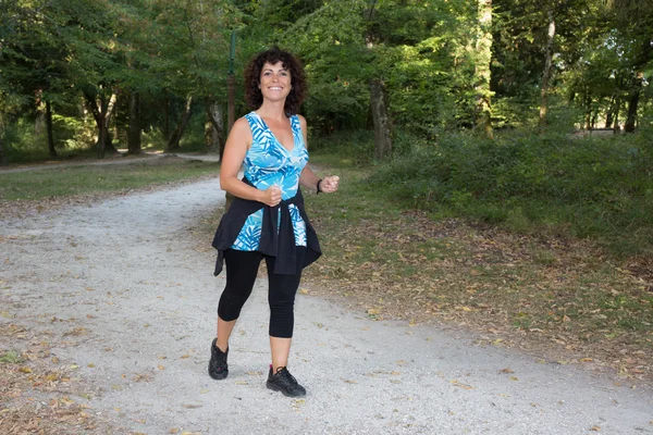 Running woman. Female Runner Jogging during Outdoor Weight Loss