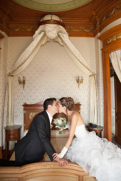 Newly married couple in hotel room