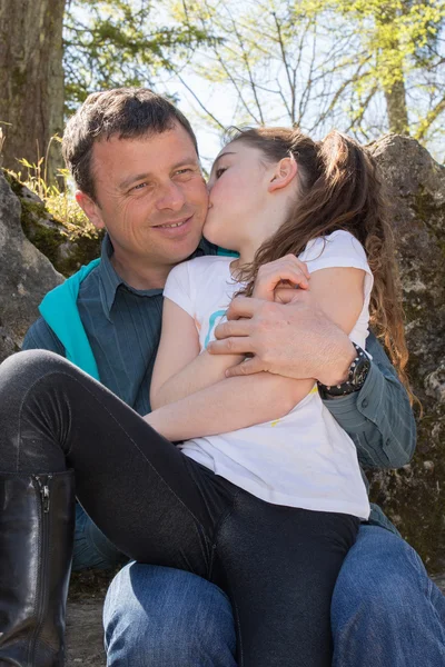 Dad helps daughter stretch