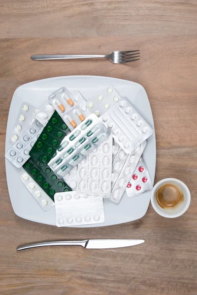 A Pills on a plate as food supplement