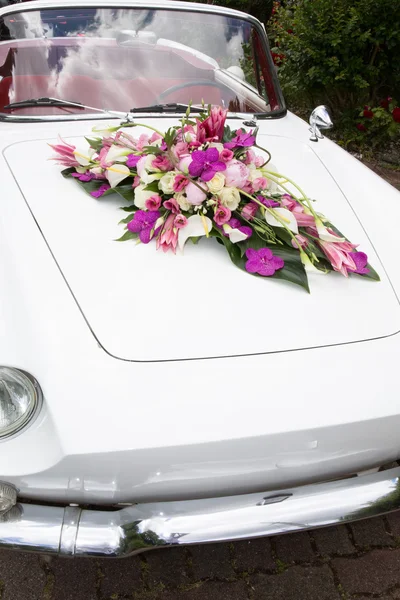 Vintage Wedding Car Decorated with Flowers.